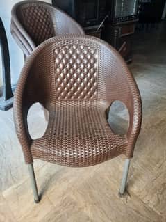 6 brown plastic chairs