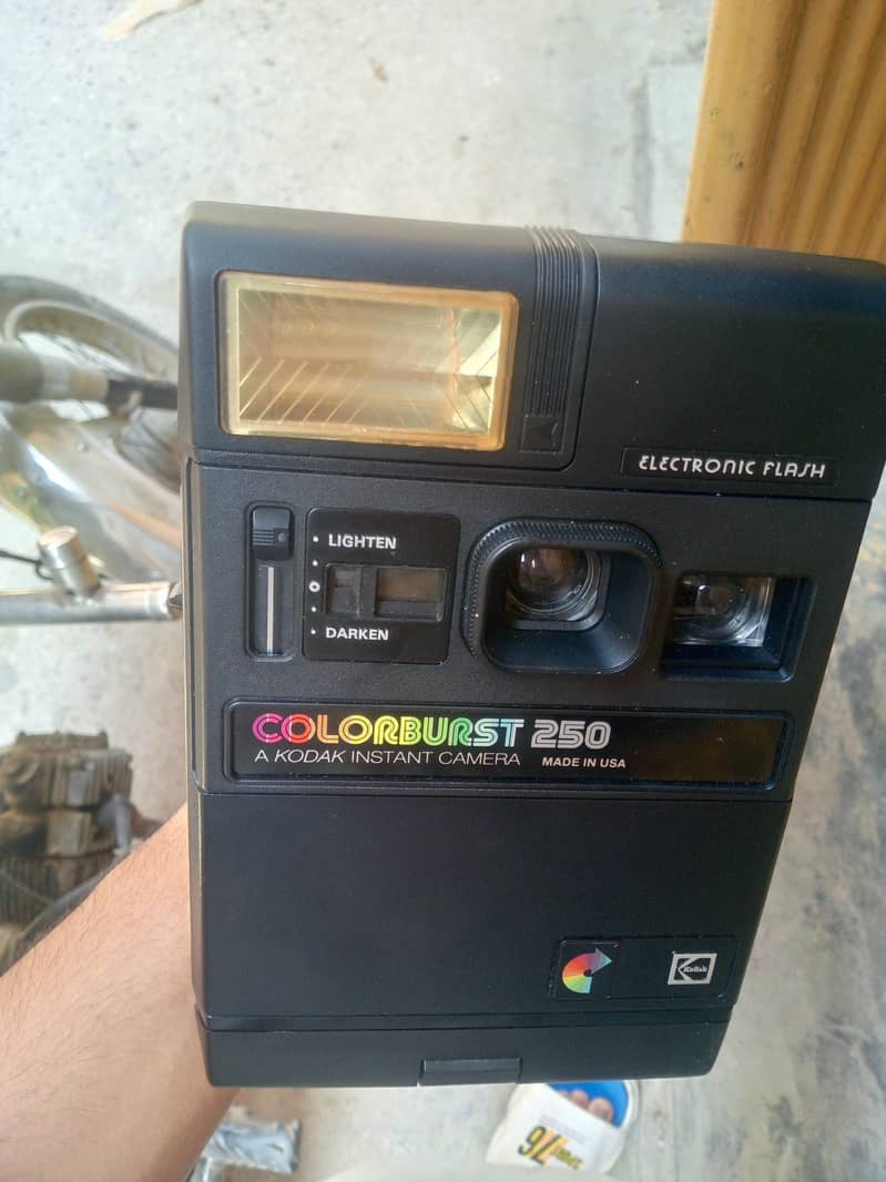 electronic flash camera   and.  it can also print the picture 4