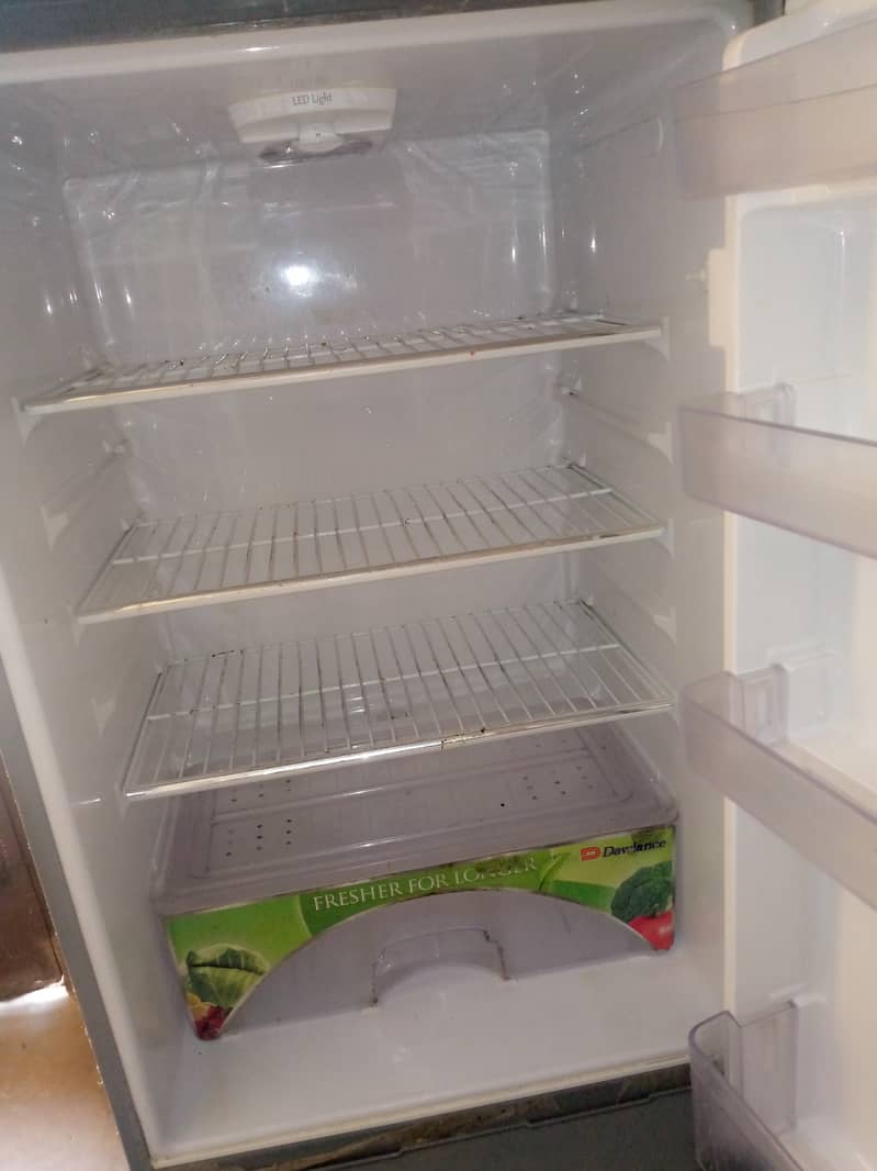 Dawlance Refrigerator with stand (choki) in A one condition,no fault. 2