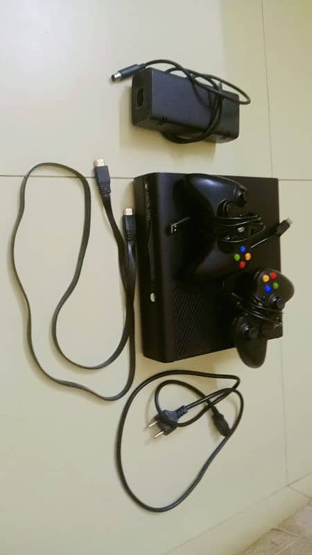 Xbox 360 E with one CD and two controllers 0