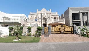 1-Kanal Architect-Designed Spanish Bungalow In DHA Phase 6 Featuring Full Covered Basement Furnished , 7 En-Suite Bedrooms, 3 TV Lounges, Store Room & Modern Luxury Touches Throughout