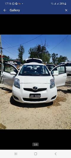 Toyota vitz 2010 model 13 registered Lahore  ok my own name file