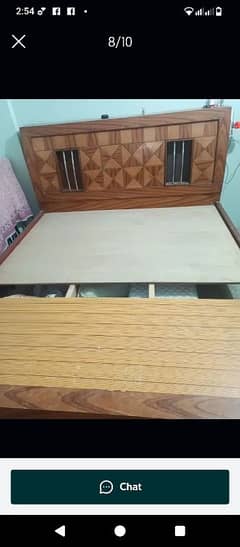 Wooden bed with mattress