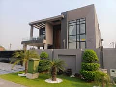 Outstanding Offer in DHA Phase 6 A 1-Year Used Fully Furnished 1-Kanal Bungalow with 5 Beds, Attached Baths, TV Lounge, Basement, Dual Kitchens, and 2 Servant Quarters Main Road Access with Easy Deal by Wall Green Realtors