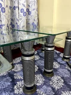 A beautiful glass table set is available for sale