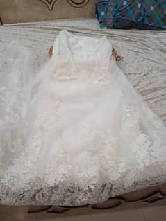 Maxi in white colour and lehanga in green colour