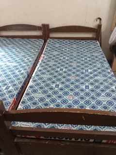 Wooden Pair of single bed with almost new metress