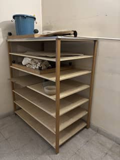 Large wooden and metal Shelves with plywood tops.