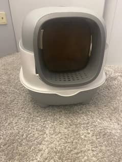 Cat litter box with scratcher.