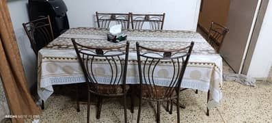 Iron rod 6 setter with glass rectangular table