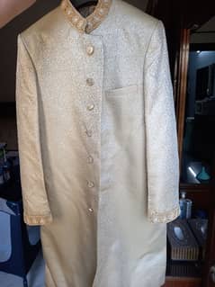 Golden sherwani with khussey