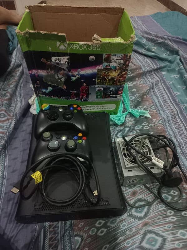 Xbox 360 with two wireless controllers 0