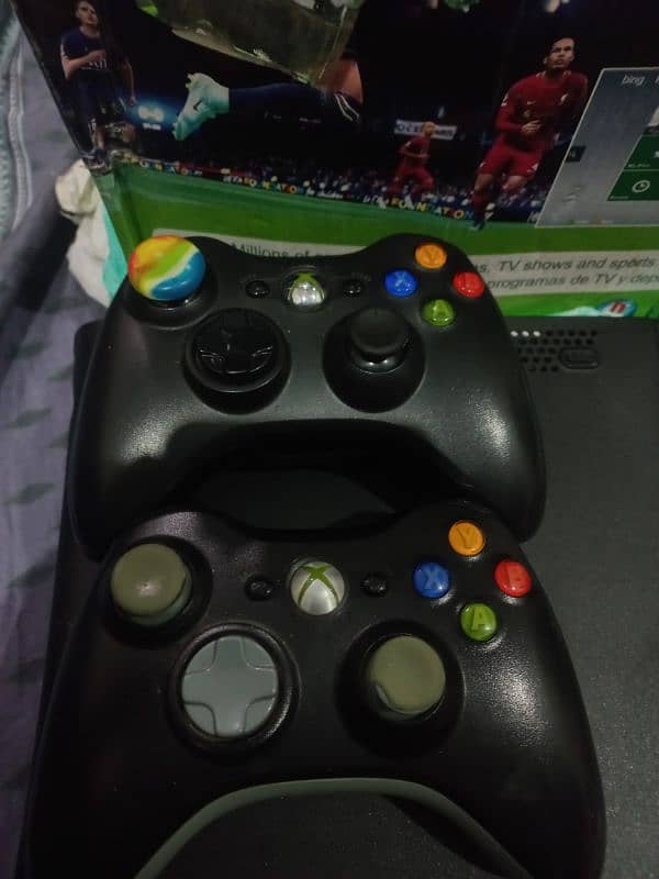 Xbox 360 with two wireless controllers 1