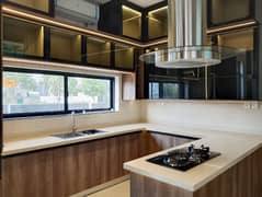 Invest in Peace, Prestige, and Prime Living A 1-Kanal Masterfully Constructed Bungalow in DHA Phase 7 Offering Wide Road Access, Secure Surroundings, Lavish Basement, Elegant Interiors, and Complete Comfort with Emarat Real Estates Easy Deal