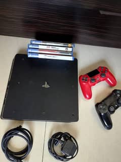 PS4 slim with controllers and games