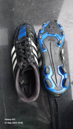 Football shoes medium size studs .