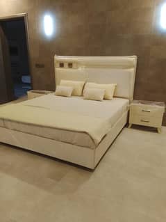 new bed and side table with mattress and with bed sheet