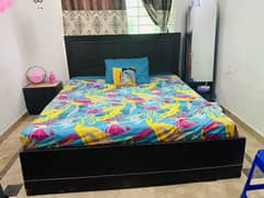 Bed with side tables