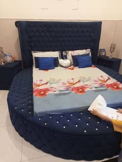 Round bed in blue with side tables mattress and dressing in wooden