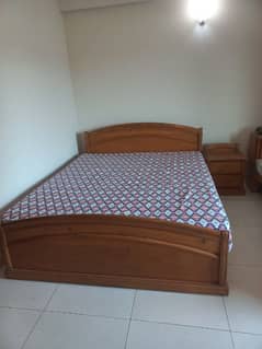 Queen bed with mattress and  side table