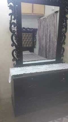 bed with 2 side tables and dressing table