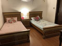 2 Single beds with 2 side tables ( mattress included)