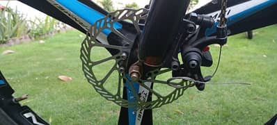 2 Bicycles, 1 in red-black 26inch, 2nd in green-black 24inch
