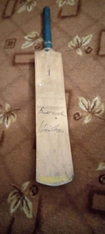 A Bat with "Mohsin Hasan Khan's" autograph 3