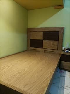 custom made wooden bed with big side table