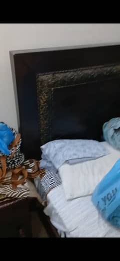 king size bed with side tables and mattress