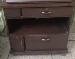 TV trolley in good condition, with drawers and a cabinet below.