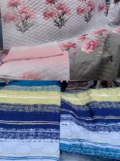 pack of two quilted bed sets