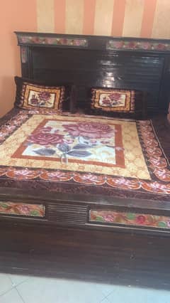 Wooden bed with dressing