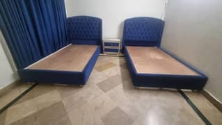 Two single beds with mattresses