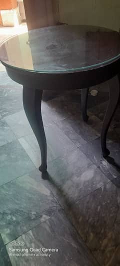 round table and a velvet brown stool