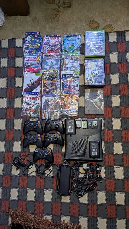 x-box 360 with 5 controllers and many games 0