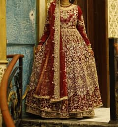 Bridel dress in dark red color single time used