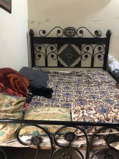 double bed of metal without mattress and sheets. only bed