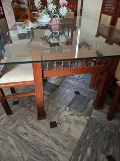 8 seater dinning table with glass top