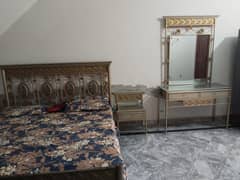 bed with two side tables, one dressing and mattress