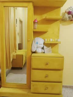 bed with side table and dressing table