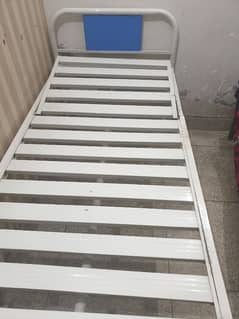 single medical bed and suction machine.
