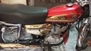 honda 125 self start gold red
