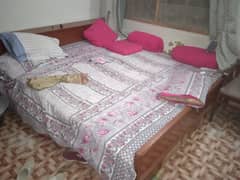 bed without metress  and one dressing table