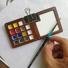 Watercolour palette with daler rowney aquafine paints and paintbrush