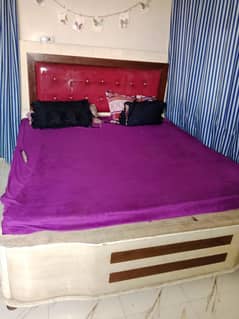 Bed with side table and dressing