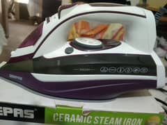 Geepas steam iron 3000 Watt.      water tank capacity 400ml.