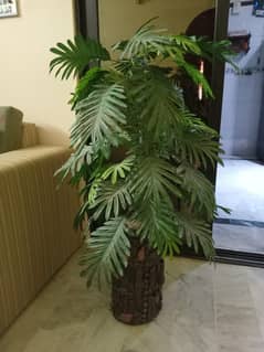 Artificial planter with plant