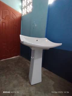 Ceramic and has a white glossy Basin