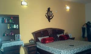 double bed with dressing table and side tables